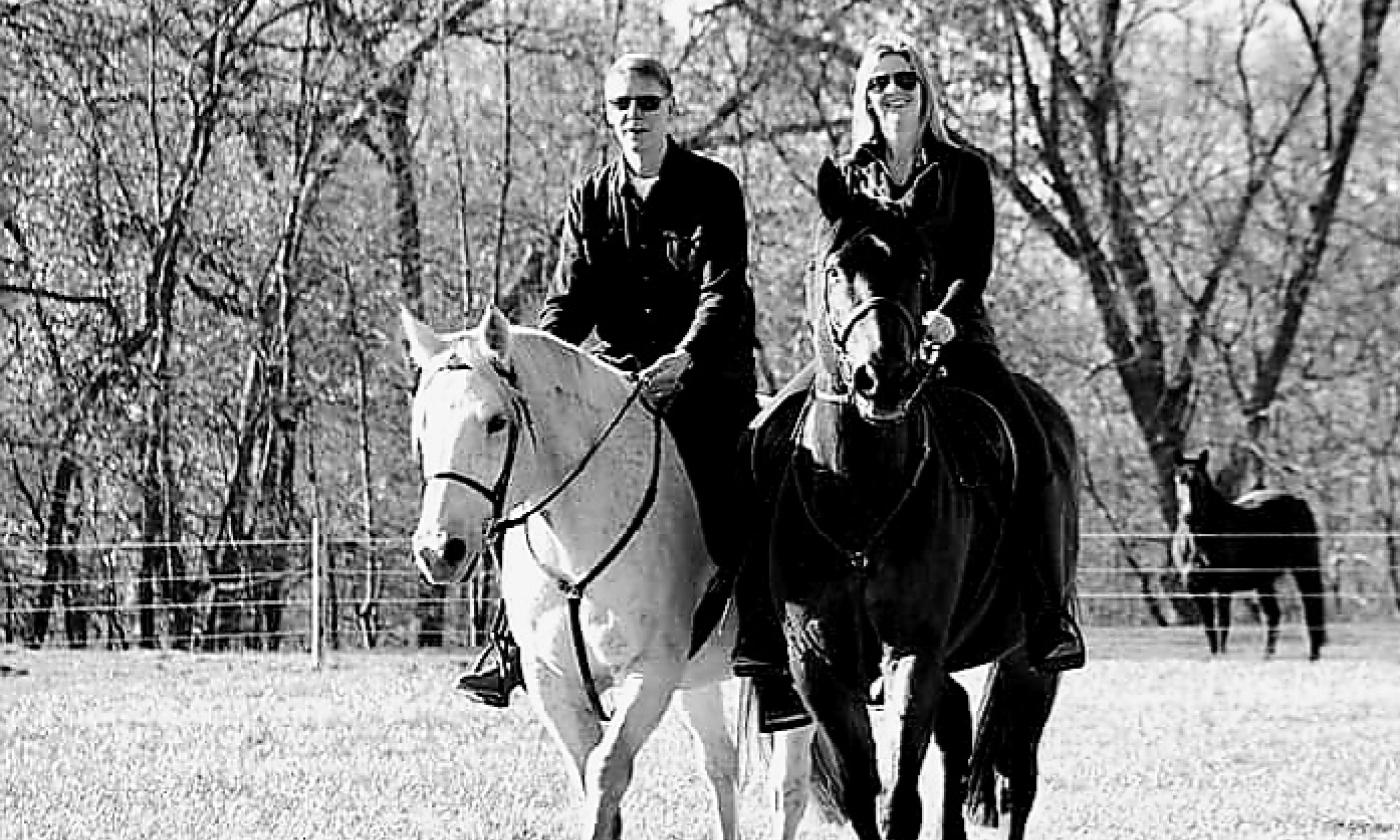 Steve and Heather Williams riding horses