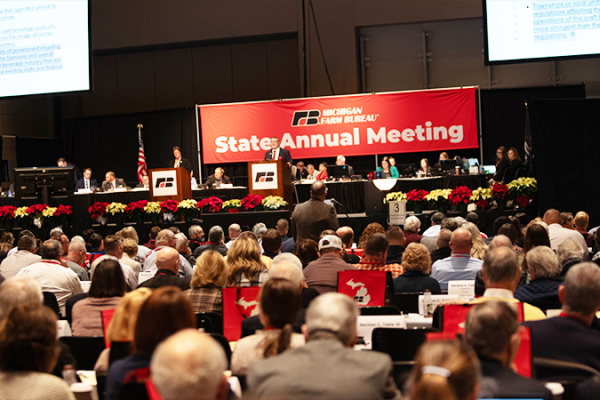 Wide shot of the bustling delegate floor of the 2023 MFB Annual Meeting.