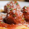 Close-up of a plate of spaghetti and meatballs.